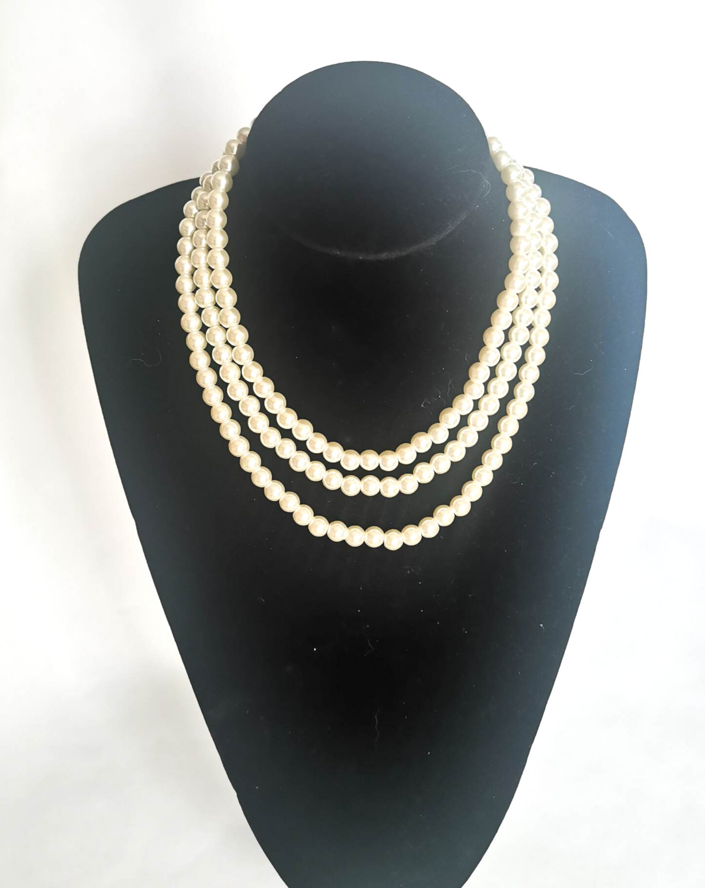 Three string pearl necklace