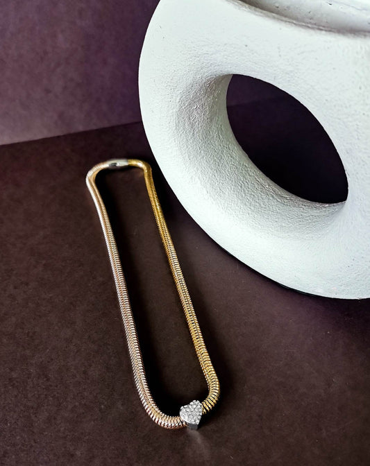 Gold tone necklace with crystal heart detail