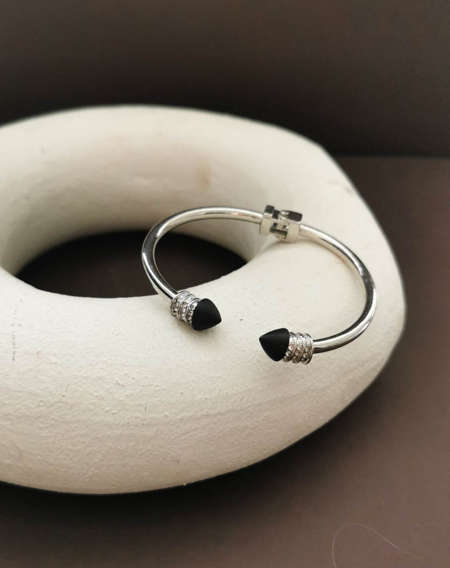 Silver tone crystal hinged cuff