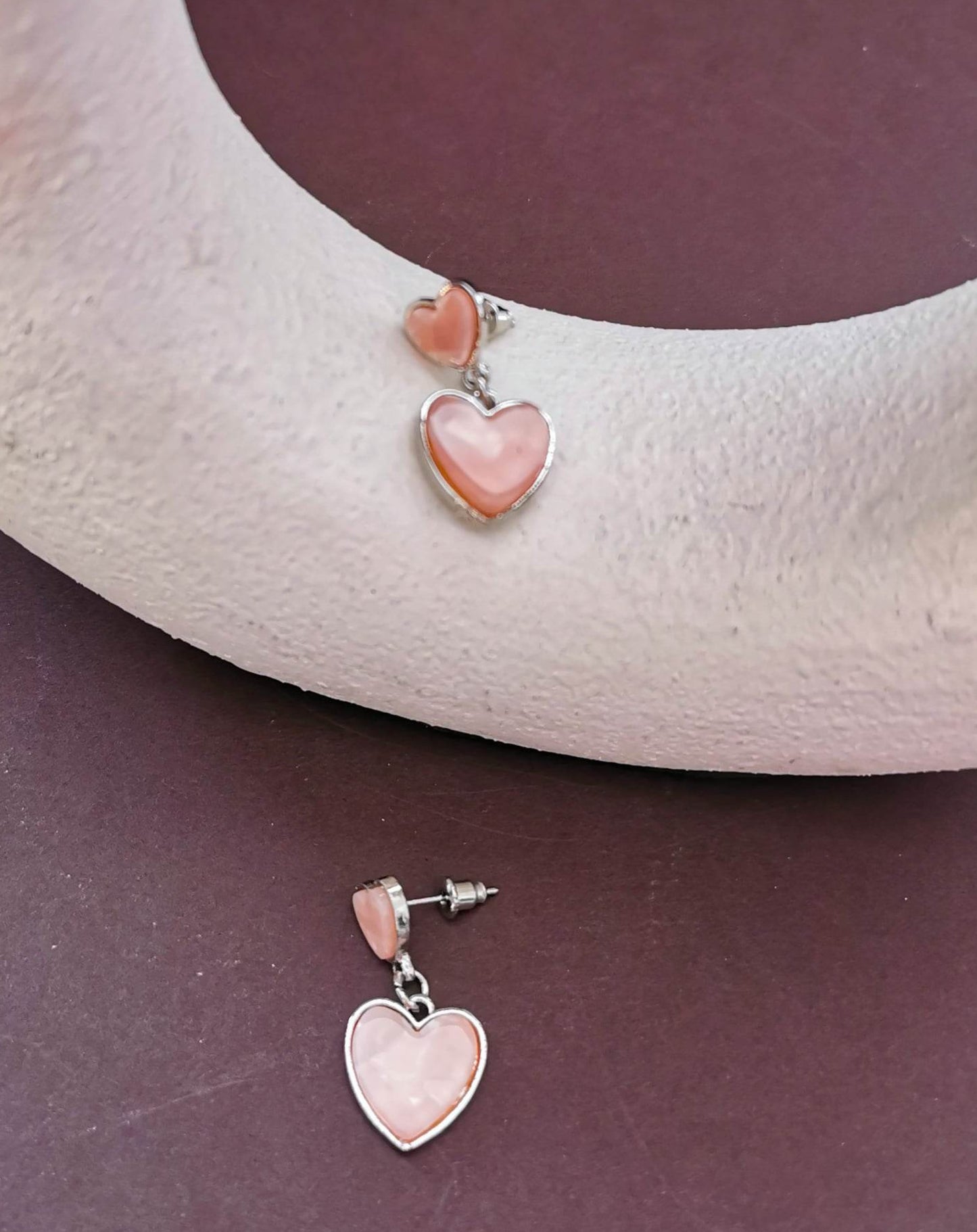 Double heart mother of pearl effect earrings