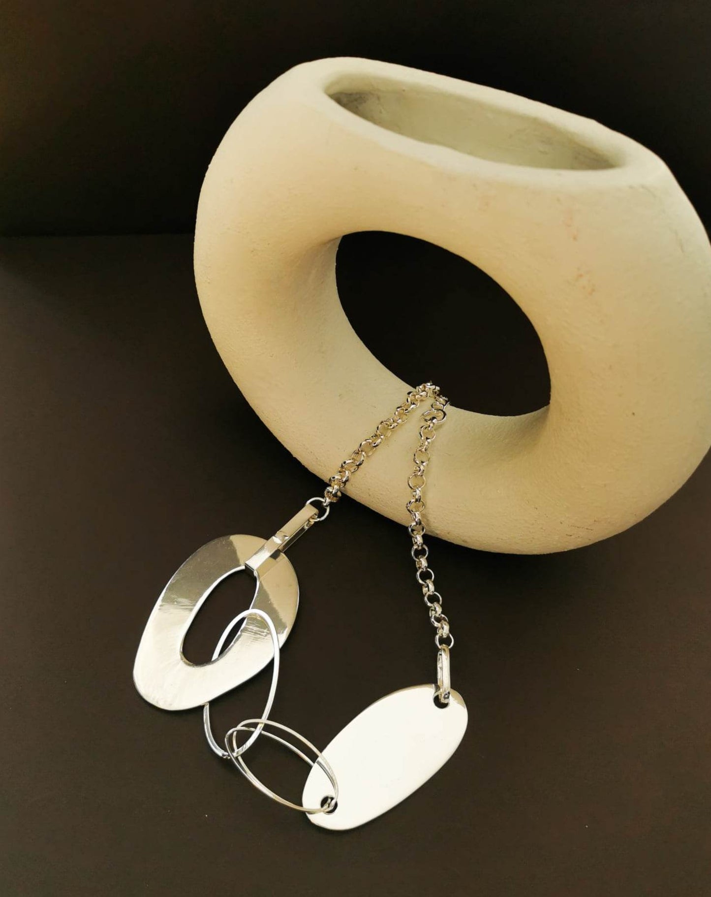 Asymmetric silver tone necklace