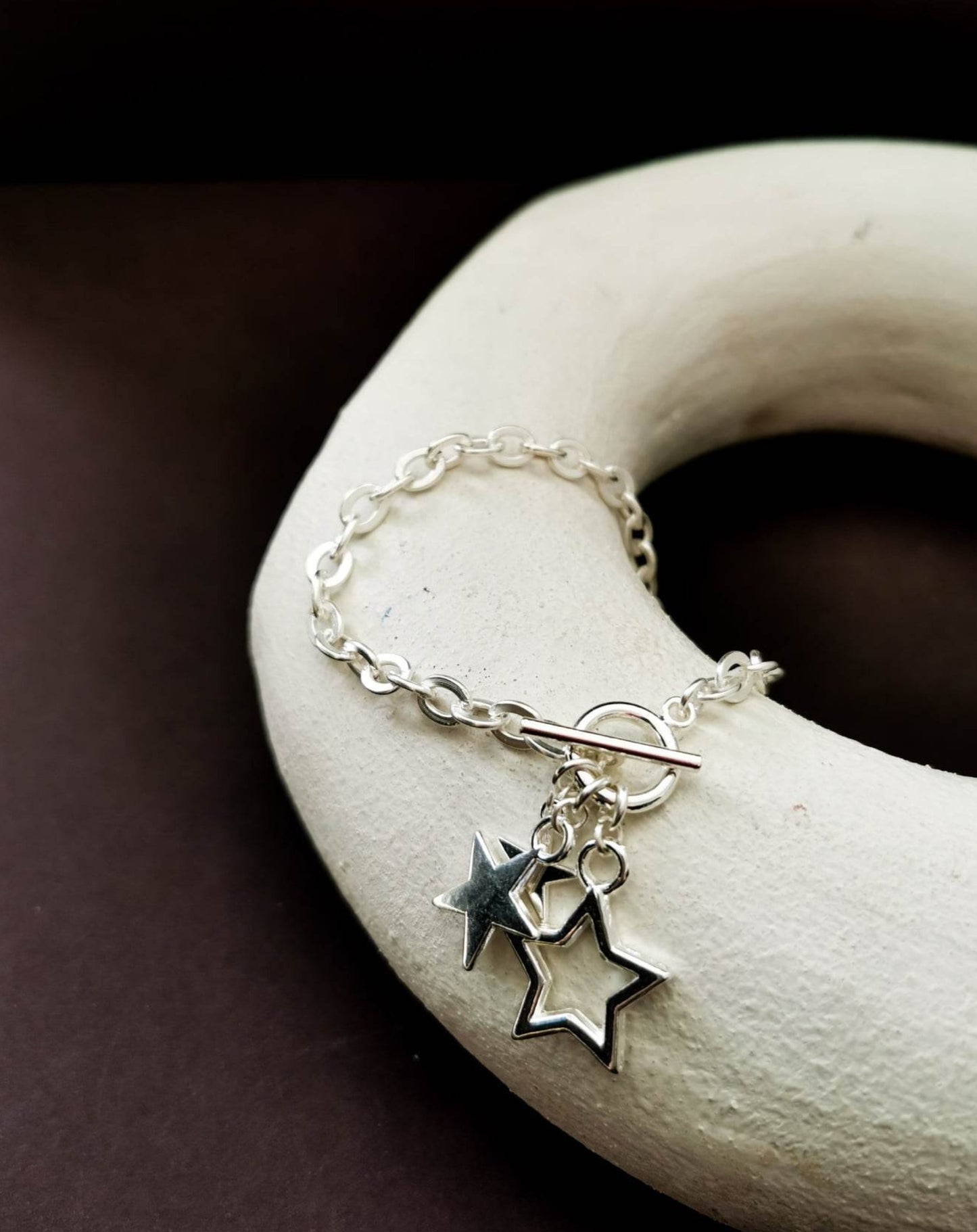 Silver plated star bracelet with toggle fastening