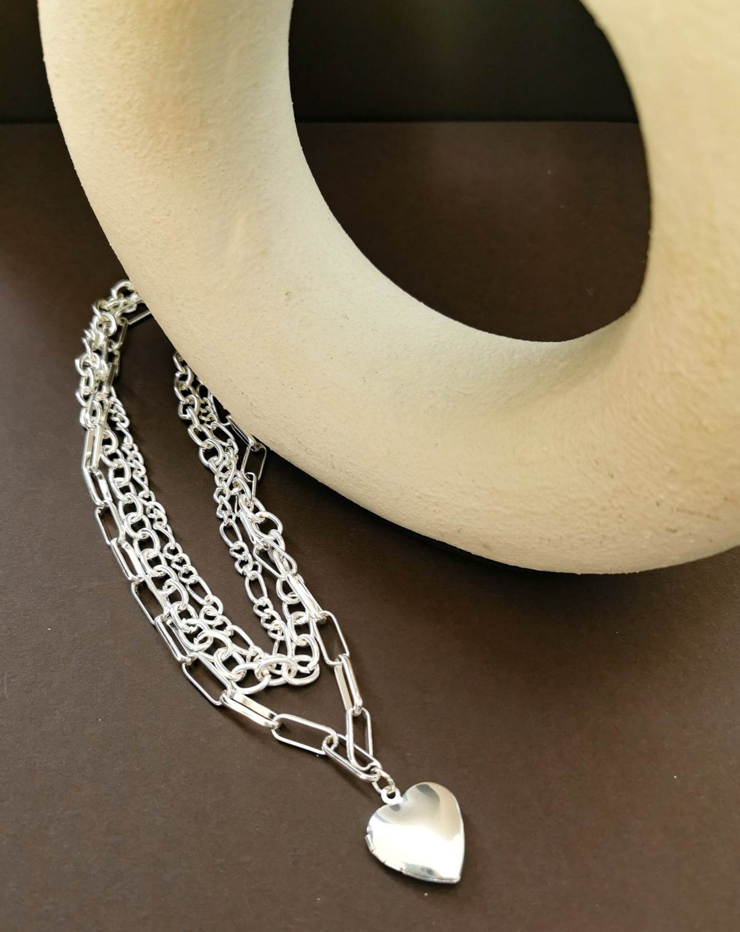 Silver or gold tone locket with multiple chains