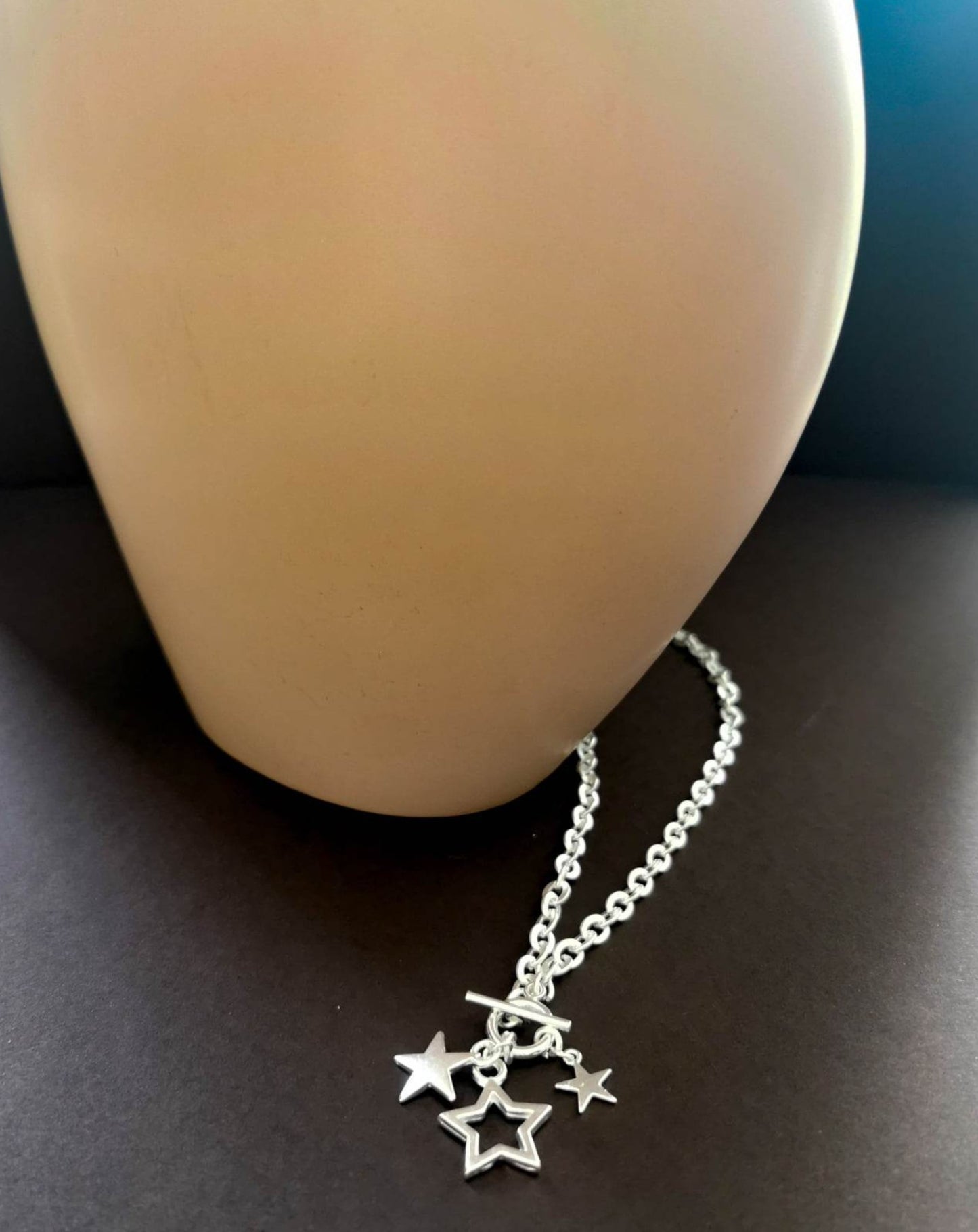Silver plated star necklace with toggle fastening