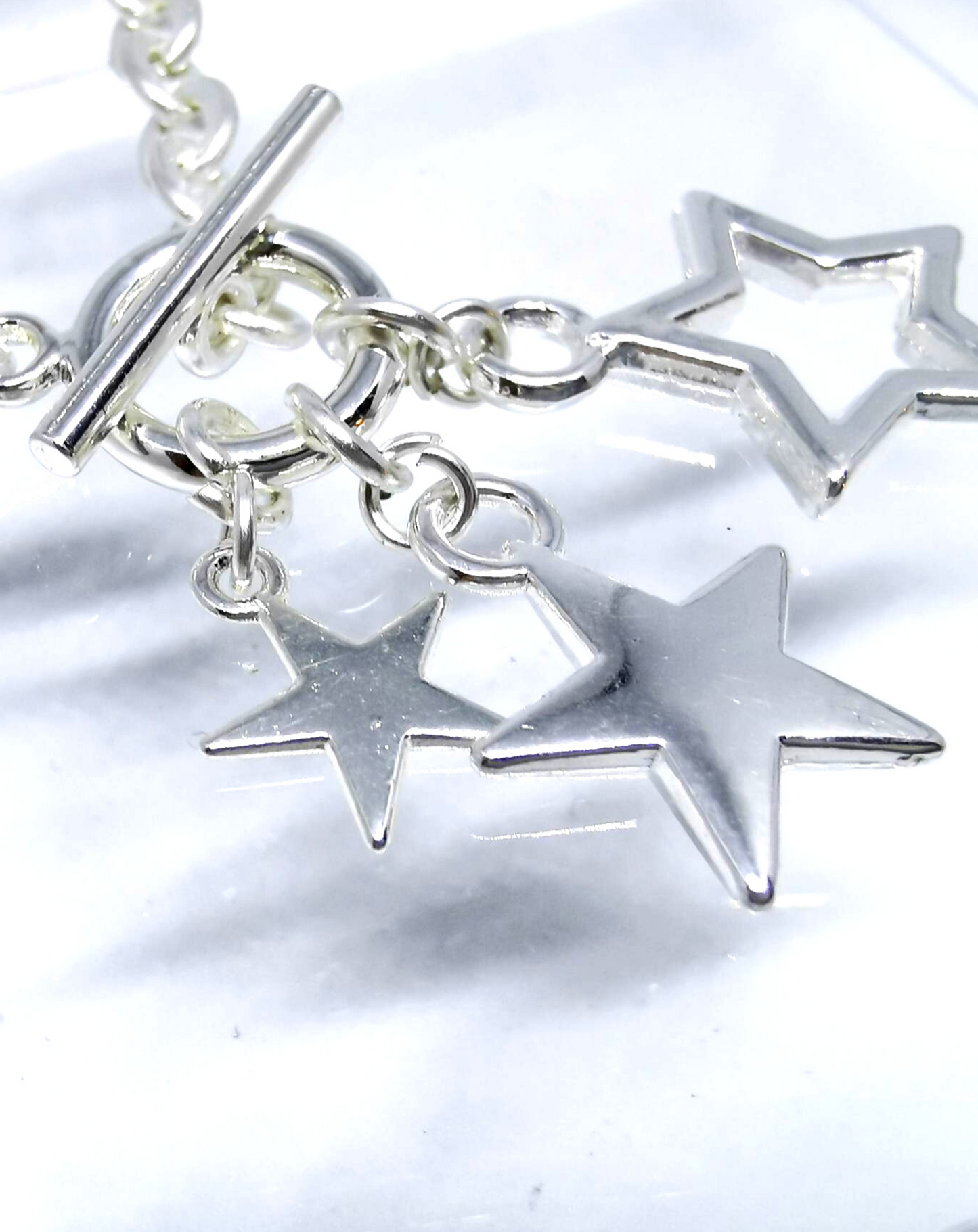 Silver plated star bracelet with toggle fastening