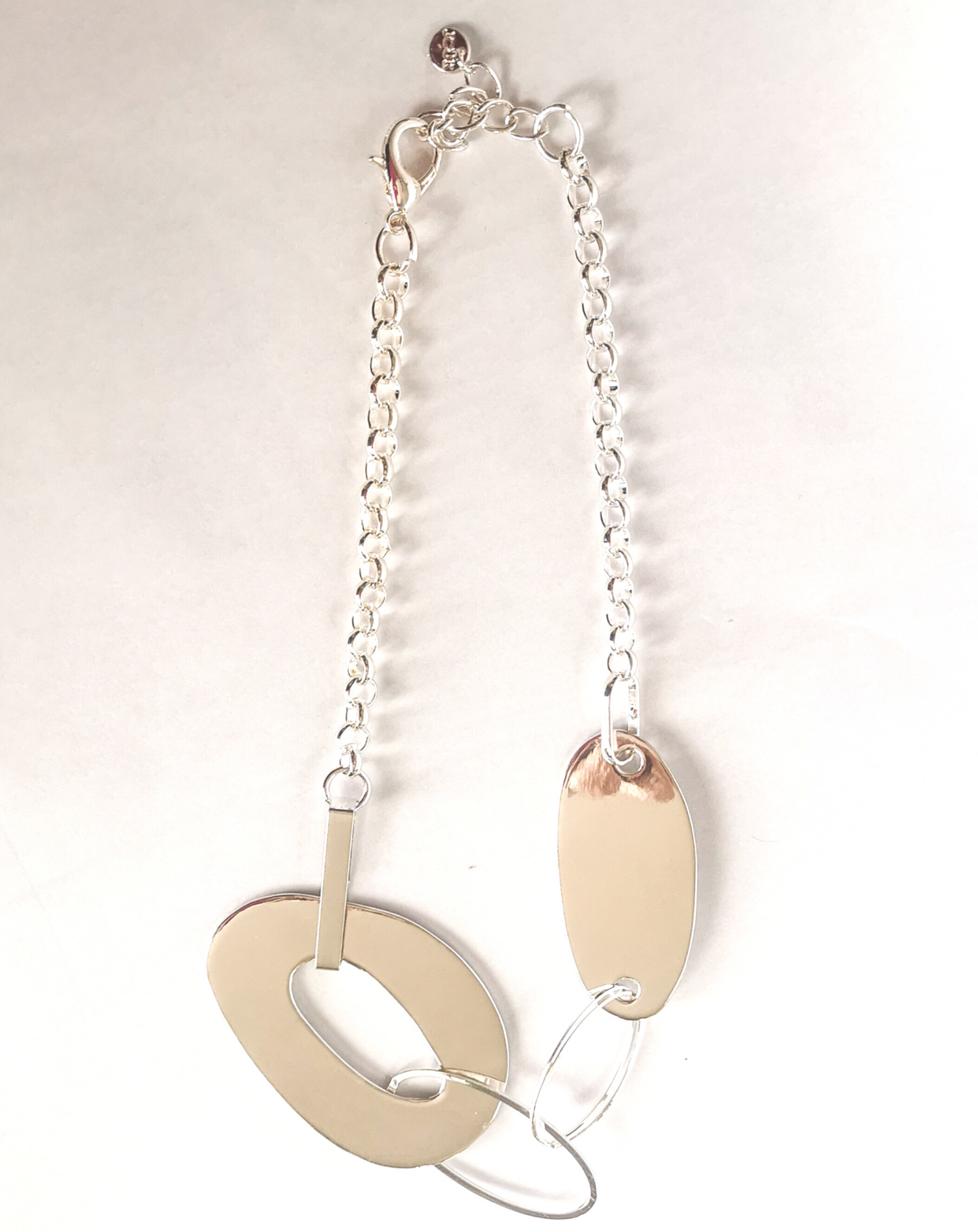 Asymmetric silver tone necklace