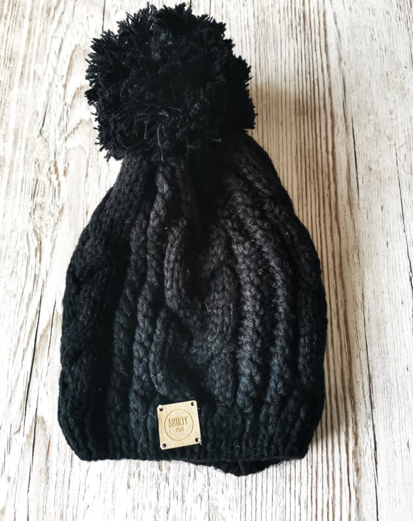 Black chunky knit bobble hat