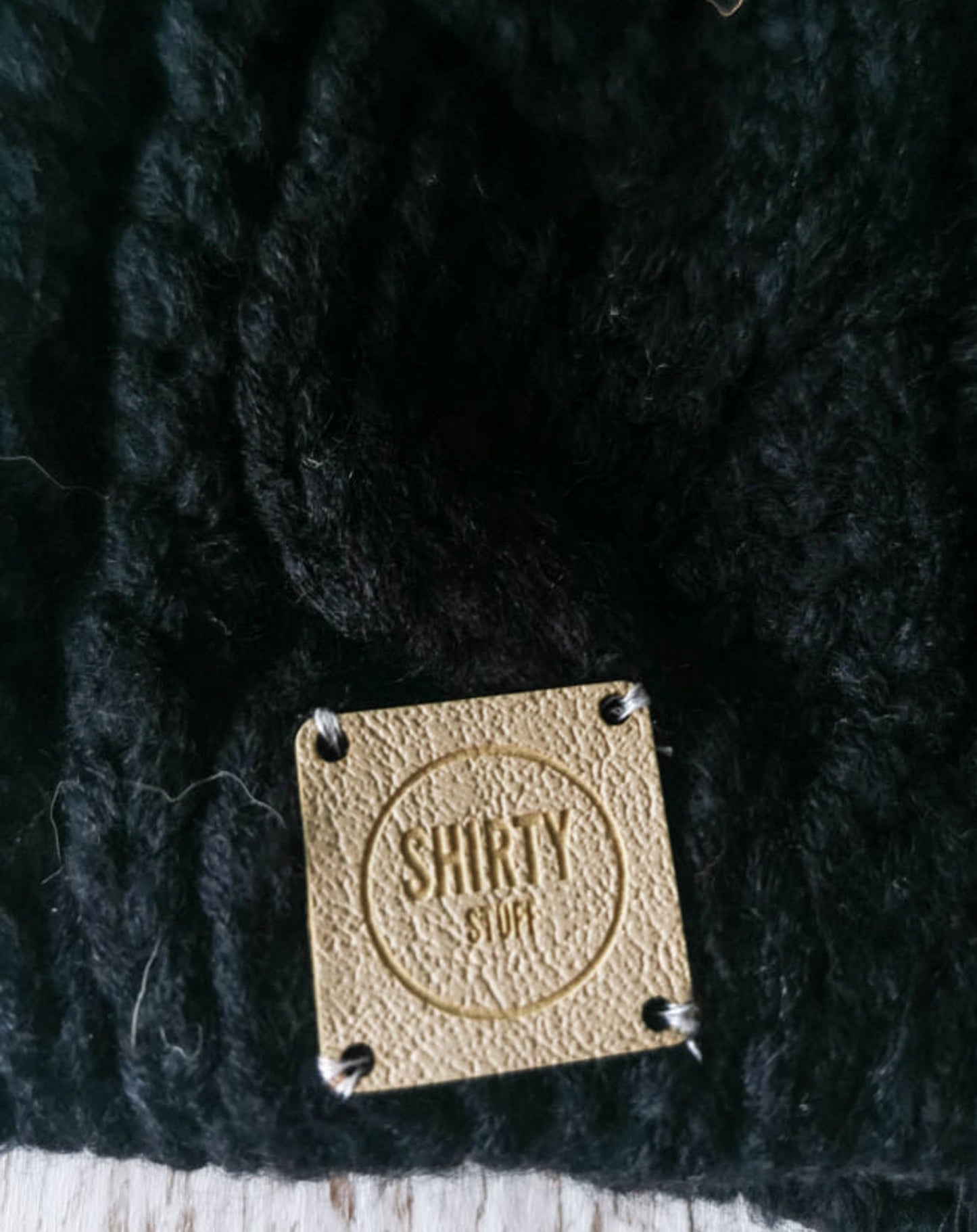 Black chunky knit bobble hat